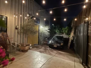 Warm evening glow from custom-installed patio lights by Sacramento residential electrician